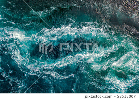 Waves of water of the river and the sea meet each 58515007
