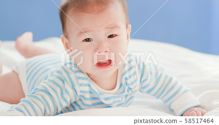 baby lying on the bed baby lying on the bed 58517464