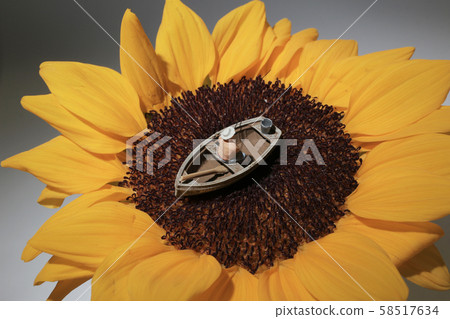 a mini figure is fishing on the sun flower a mini figure is fishing on the sun flower 58517634