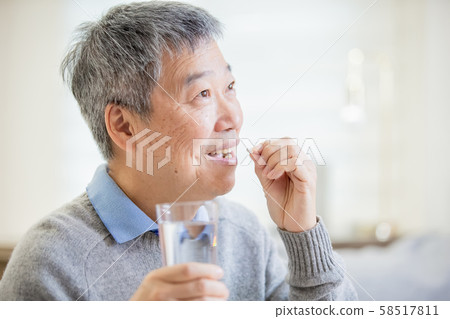 old asian man take medicine old asian man take medicine 58517811