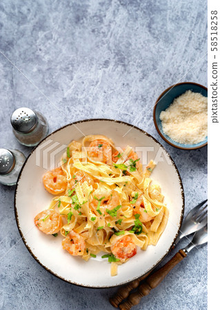 Top view of tasty shrimp fettuccine alfredo 58518258