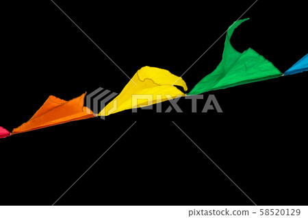 Colorful triangles flags ornament for carnival and holiday hang on a rope and flutter in the wind 58520129