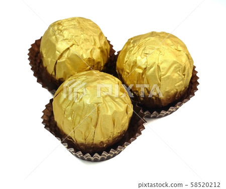 Brown Round Chocolate Candies in Gold Package Brown Round Chocolate Candies in Gold Package 58520212