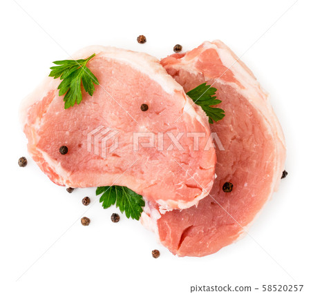 Two pieces of raw meat pork with parsley leaves Two pieces of raw meat pork with parsley leaves 58520257