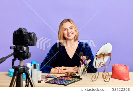 Attractive young female beauty blogger recording new content for video blog 58522208