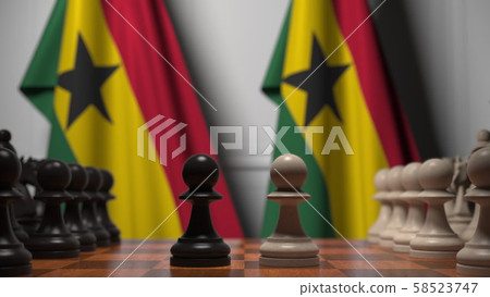 Chess game against flags of Ghana. Political competition related 3D rendering Chess game against flags of Ghana. Political competition related 3D rendering 58523747