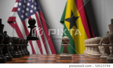 Flags of USA and Ghana behind pawns on the chessboard. Chess game or political rivalry related 3D Flags of USA and Ghana behind pawns on the chessboard. Chess game or political rivalry related 3D 58523749