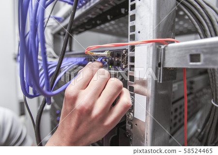 Engeneer in network server room Engeneer in network server room 58524465