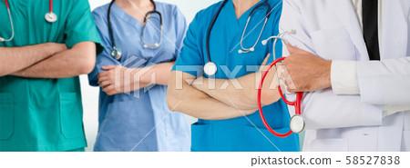 Doctor working in hospital with other doctors. Doctor working in hospital with other doctors. 58527838