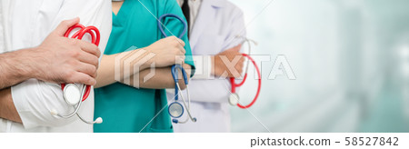 Doctor working in hospital with other doctors. Doctor working in hospital with other doctors. 58527842