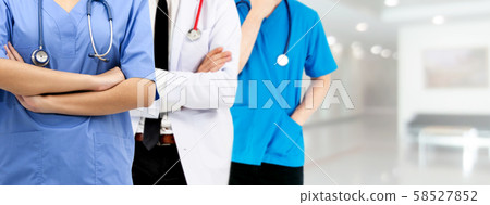 Doctor working in hospital with other doctors. Doctor working in hospital with other doctors. 58527852