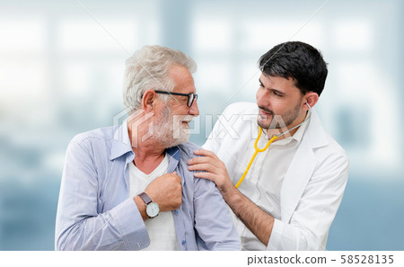 Doctor checking patient health in hospital office. 58528135