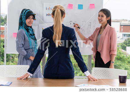Multicultural working group in teamwork meeting. 58528688
