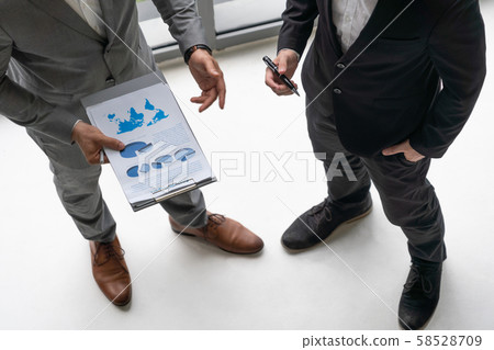 Businessmen are in business meeting in office. Businessmen are in business meeting in office. 58528709