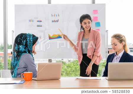 Multicultural working group in teamwork meeting. 58528830