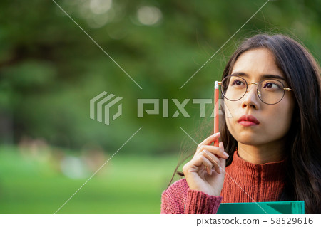 Creative student girl thinking or planning future. Creative student girl thinking or planning future. 58529616