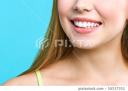 Perfect healthy teeth smile of a young woman. Teeth whitening. Dental clinic patient. Image Perfect healthy teeth smile of a young woman. Teeth whitening. Dental clinic patient. Image 58537352