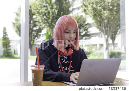 Female designer with pink hair Female designer with pink hair 58537486