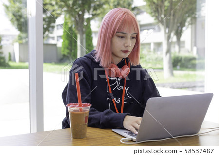 Female designer with pink hair Female designer with pink hair 58537487