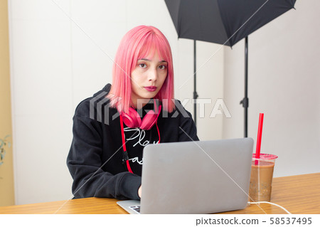 Female designer with pink hair Female designer with pink hair 58537495