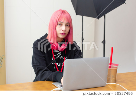 Female designer with pink hair Female designer with pink hair 58537496