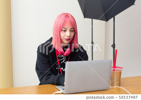 Female designer with pink hair Female designer with pink hair 58537497