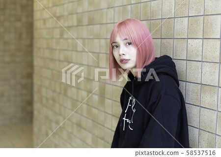 Female designer with pink hair Female designer with pink hair 58537516