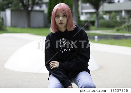 Female designer with pink hair Female designer with pink hair 58537536