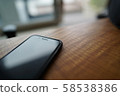 Spend a great time at the table seats near the window with gentle sunlight. 58538386