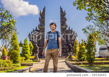 Young man tourist in budhist temple Brahma Vihara Arama Banjar Bali, Indonesia Young man tourist in budhist temple Brahma Vihara Arama Banjar Bali, Indonesia 58538443