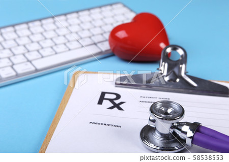 Medical stethoscope and red heart lying on cardiogram chart closeup. Medical help, prophylaxis Medical stethoscope and red heart lying on cardiogram chart closeup. Medical help, prophylaxis 58538553