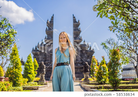 Young woman tourist in budhist temple Brahma Vihara Arama Banjar Bali, Indonesia Young woman tourist in budhist temple Brahma Vihara Arama Banjar Bali, Indonesia 58538634