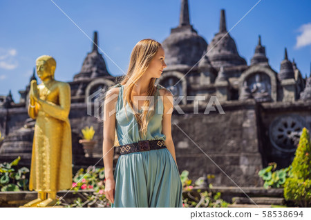 Young woman tourist in budhist temple Brahma Vihara Arama Banjar Bali, Indonesia 58538694