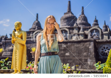 Young woman tourist in budhist temple Brahma Vihara Arama Banjar Bali, Indonesia Young woman tourist in budhist temple Brahma Vihara Arama Banjar Bali, Indonesia 58538841