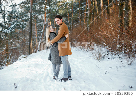 happy couple walking through the park 58539390