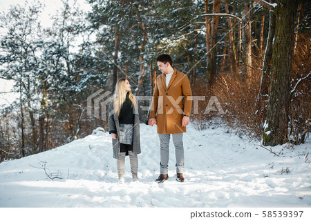 happy couple walking through the park happy couple walking through the park 58539397
