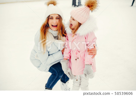 Cute and beautiful family in a winter city 58539606