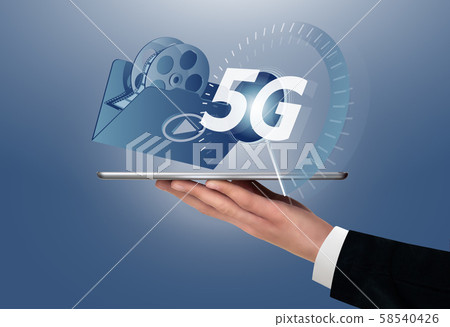 Man holding a digital tablet with symbol of 5G network for next generation video services. Man holding a digital tablet with symbol of 5G network for next generation video services. 58540426