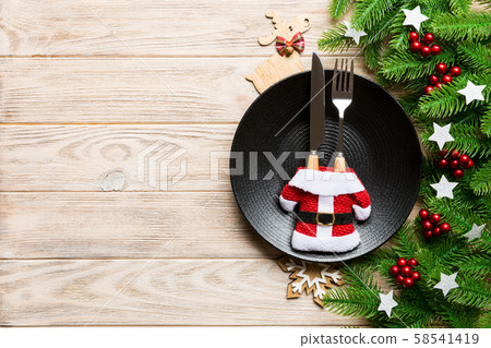 Top view of Christmas dinner on wooden background. Top view of Christmas dinner on wooden background. 58541419