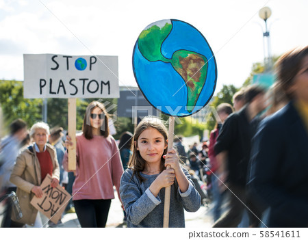 People with placards and posters on global strike for climate change. People with placards and posters on global strike for climate change. 58541611