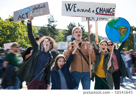People with placards and posters on global strike for climate change, shouting. 58541645