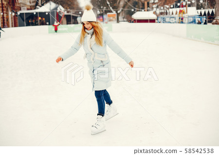 Cute and beautiful girl in a winter city Cute and beautiful girl in a winter city 58542538