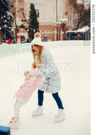Cute and beautiful family in a winter city 58542576