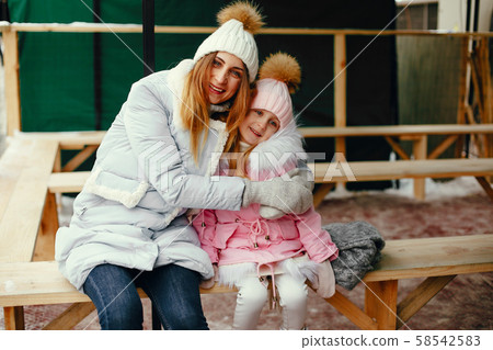 Cute and beautiful family in a winter city 58542583