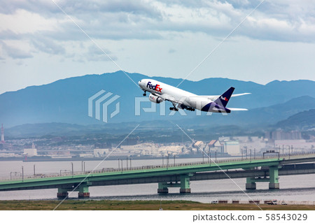 FedEx cargo plane and Kansai International Airport connecting bridge FedEx cargo plane and Kansai International Airport connecting bridge 58543029