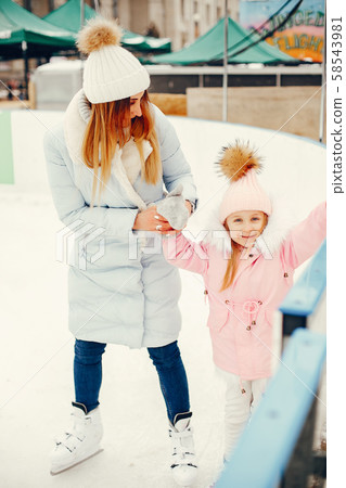 Cute and beautiful family in a winter city 58543981