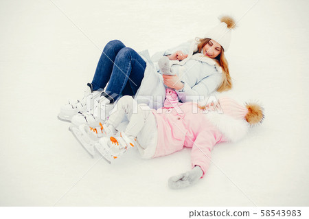 Cute and beautiful family in a winter city Cute and beautiful family in a winter city 58543983