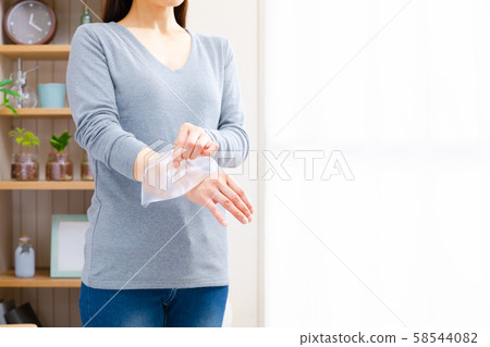 Woman who cools the wrist 58544082