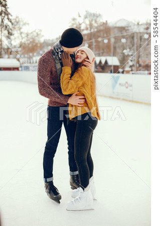 Cute couple in a ice arena Cute couple in a ice arena 58544404