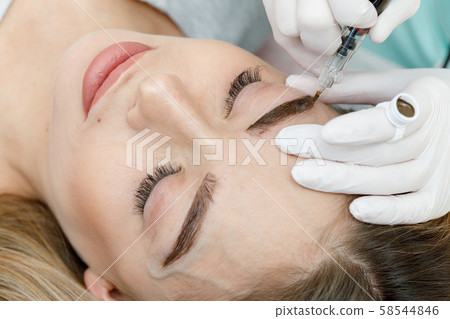 Permanent makeup, tattooing of eyebrows. Permanent makeup, tattooing of eyebrows. 58544846